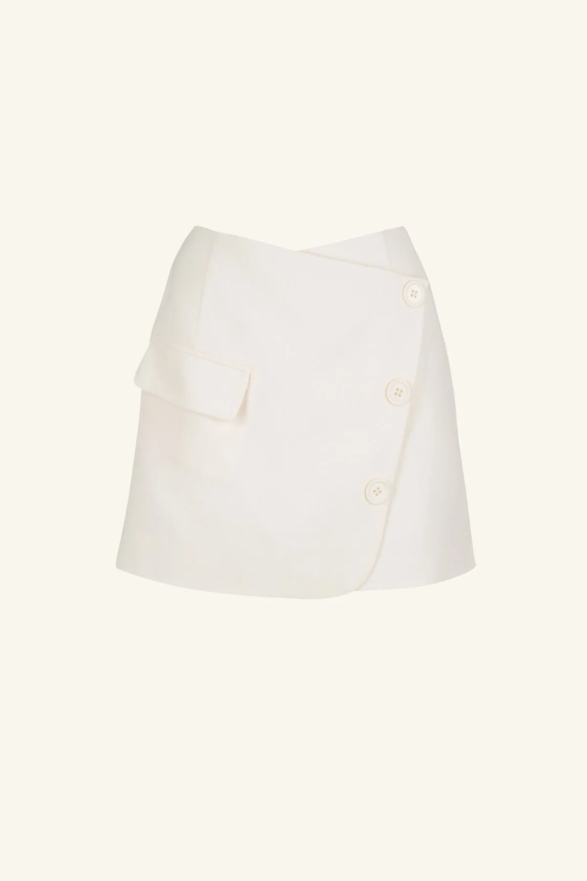 AMURA ASYMMETRICAL BUTTON MINI SKIRT - CREAM